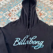 Billabong black oversized full zip hoodie with logo detail and soft material.