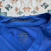 Nike blue Brazil away jersey with logo and classic design details.