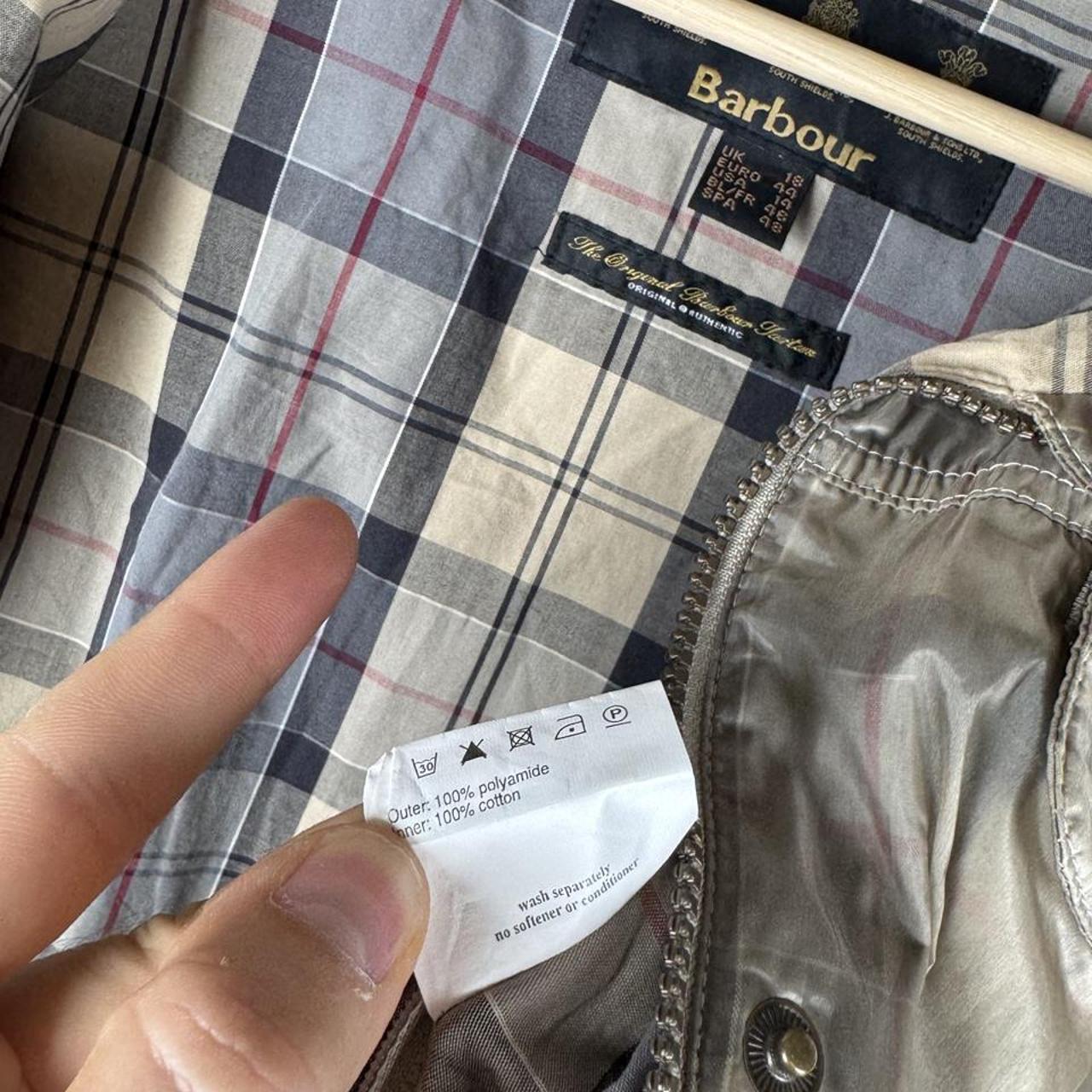 Barbour cream checkered parachute field jacket with relaxed fit and distinctive logo.