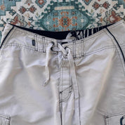 O'Neill cream board shorts with embroidered logo and relaxed baggy fit.