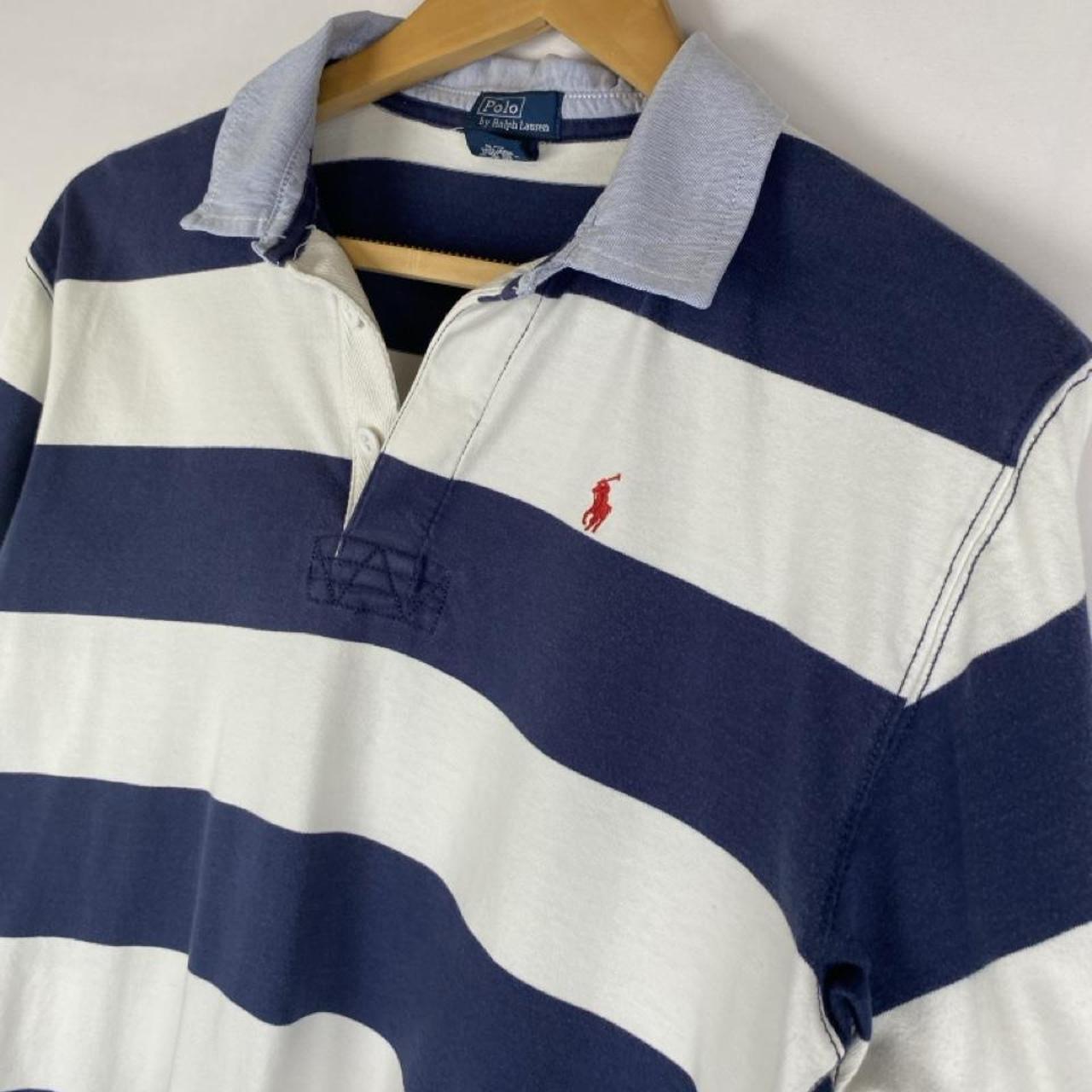 Polo Ralph Lauren blue and navy striped rugby polo shirt with logo detail.