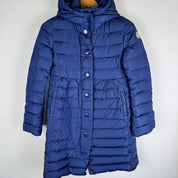 Moncler blue puffer jacket with logo detail and quilted design.