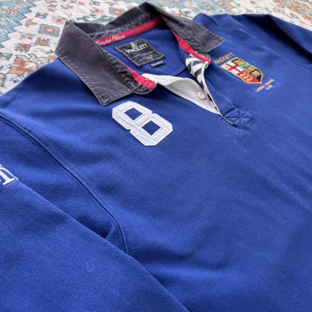 Hackett cream rugby polo with embroidered spellout logo and thick cotton material.
