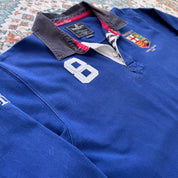 Hackett cream rugby polo with embroidered spellout logo and thick cotton material.