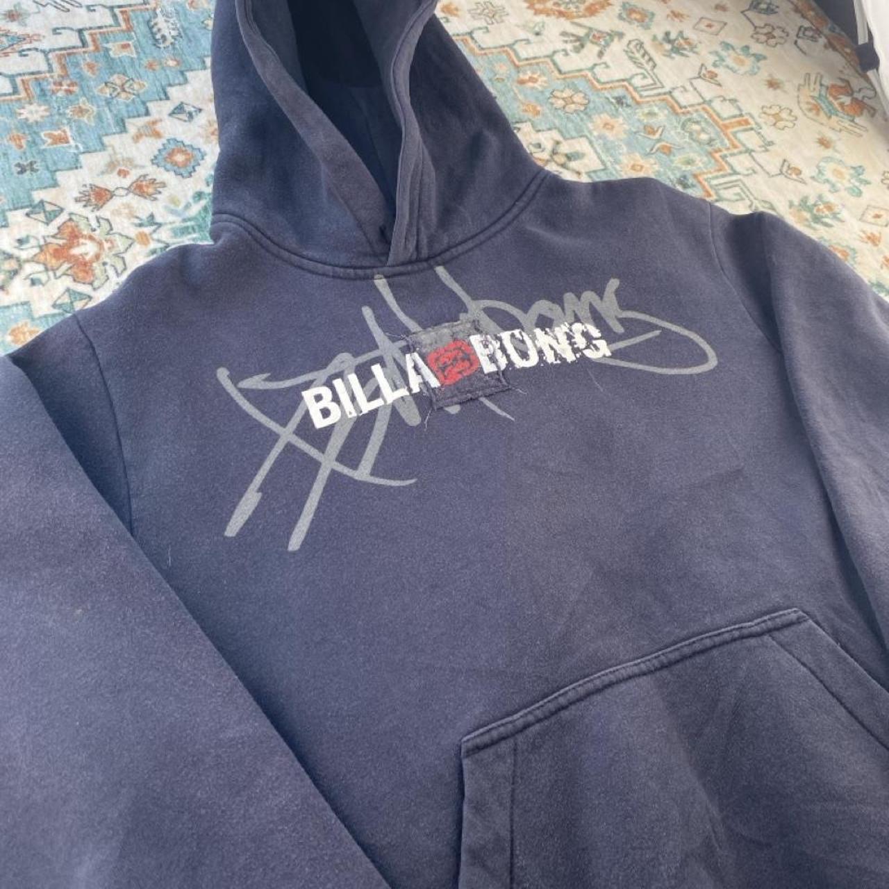 Billabong navy oversized hoodie with logo detail and soft material.