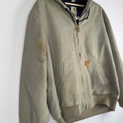 Carhartt active jacket, orange, oversized fit, visible logo, durable material.