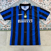 Umbro blue and navy striped home jersey with embroidered logo and vintage design.