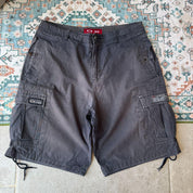 Oakley black cargo shorts with embroidered logo and tactical pockets.