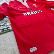 Reebok men's polo shirt red with Wales Rugby logo and slim fit design.