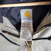 Carhartt active jacket, orange, oversized fit, visible logo, durable material.