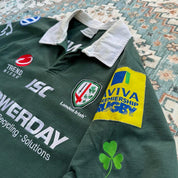 ISC green rugby polo shirt with embroidered London Irish logo and slim fit.