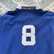 Hackett cream rugby polo with embroidered spellout logo and thick cotton material.