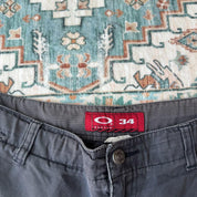 Oakley black cargo shorts with embroidered logo and tactical pockets.