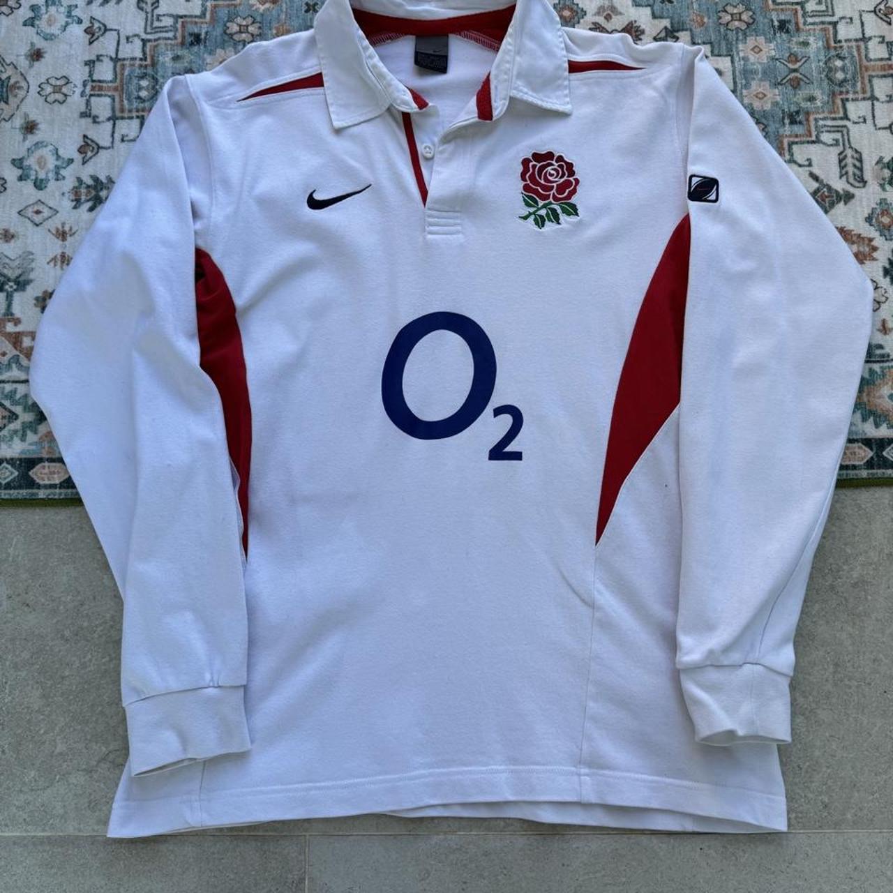 Nike long sleeve polo shirt in navy blue with embroidered England Rugby logo.