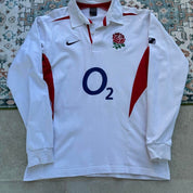 Nike long sleeve polo shirt in navy blue with embroidered England Rugby logo.