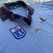 NSW Rugby League blue polo shirt with embroidered logo and vintage 1990s design.