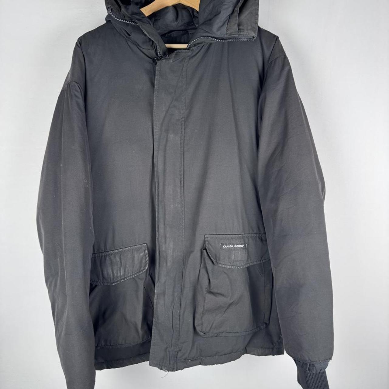 Canada Goose battered jacket black with no fur, badge, or visible holes.