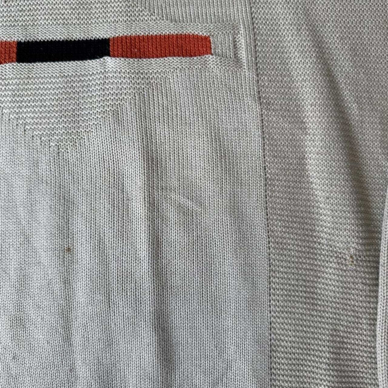 Nike cream knitted jumper with embroidered logo and visible marks from the 1990s.