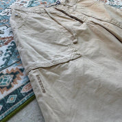 Quiksilver cream jorts with classic logo patch and vintage style from early 2000s.