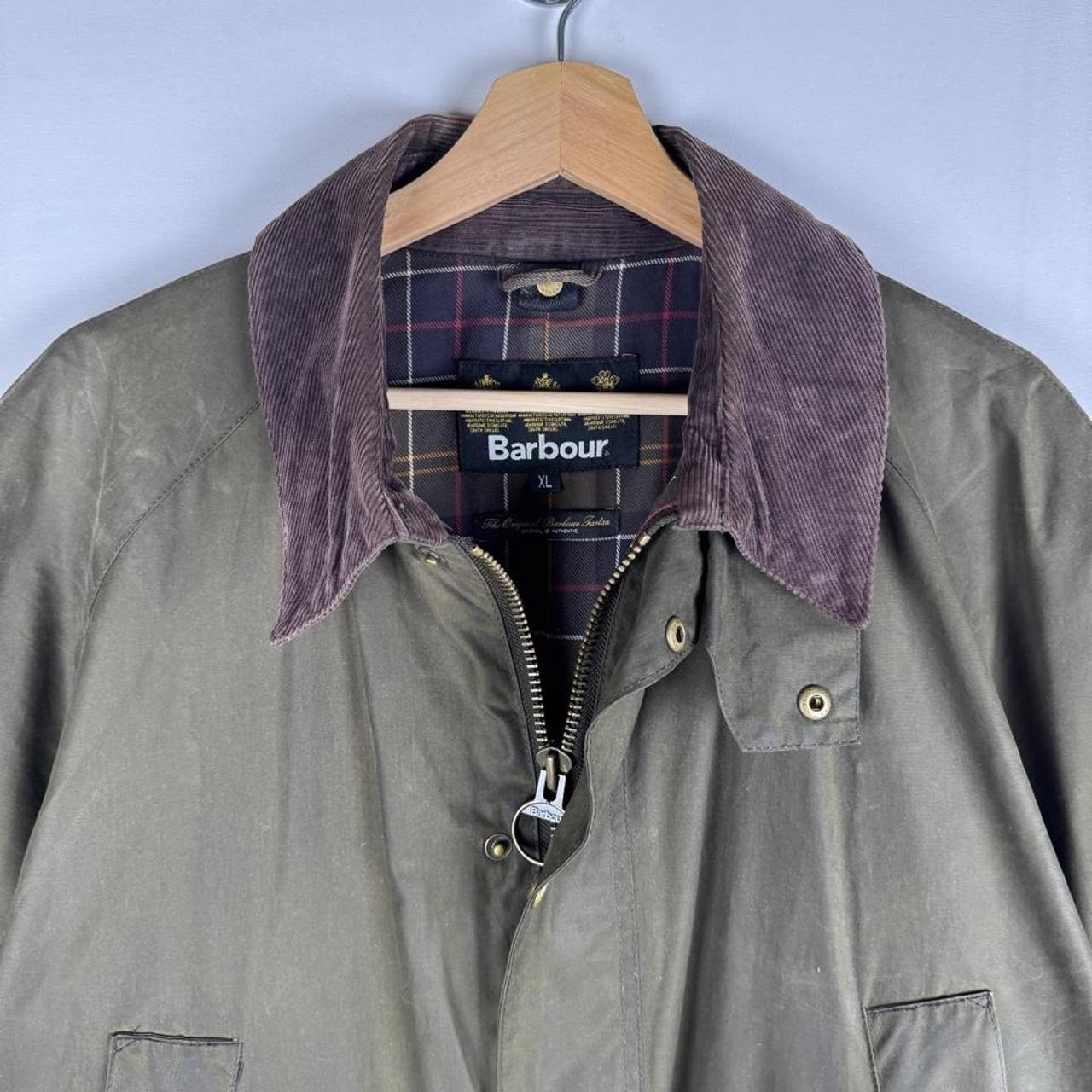 Barbour green wax jacket with logo, classic design, and durable material.