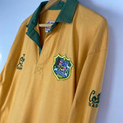 Cotton Traders green and yellow rugby polo with Wallabies logo and vintage design.