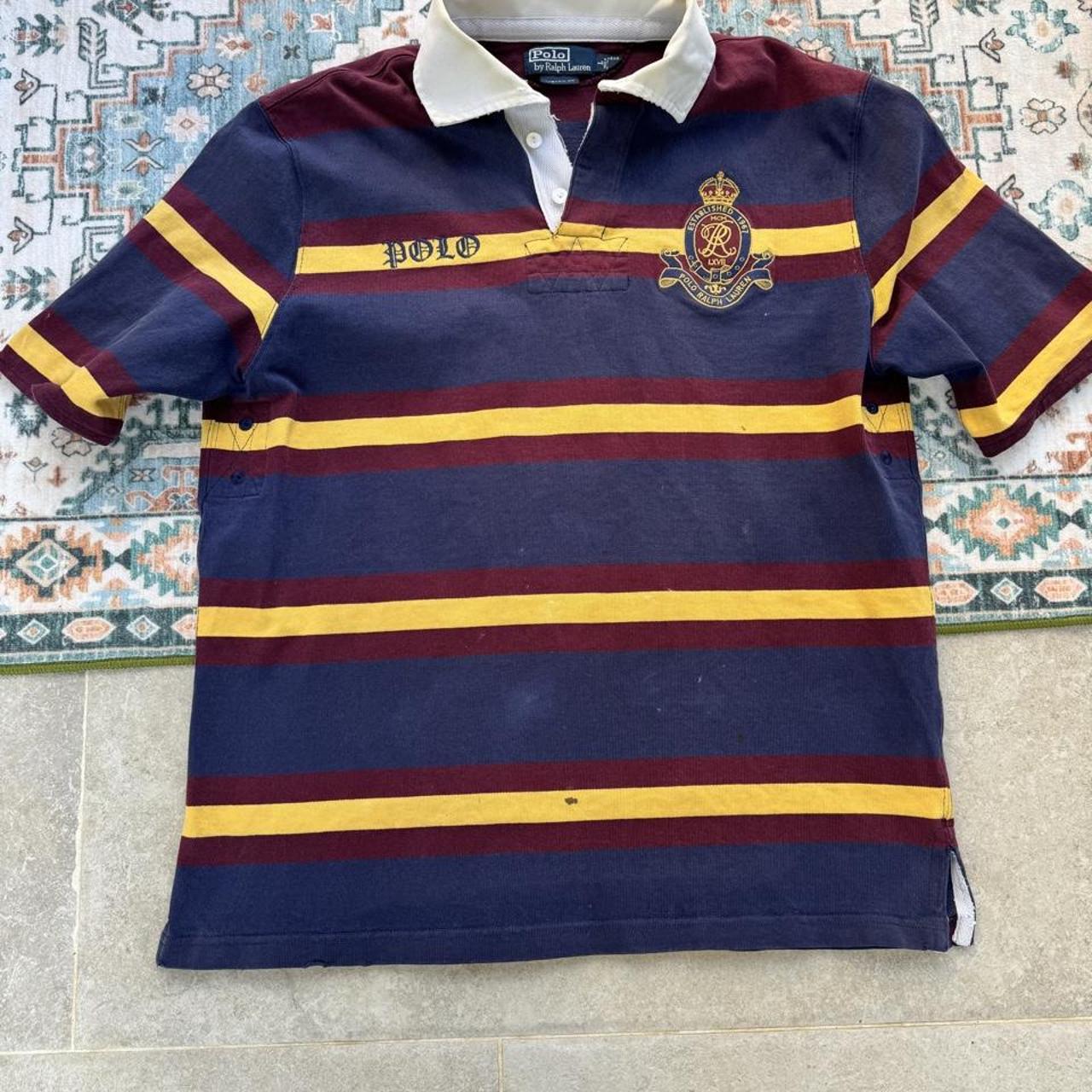 Polo Ralph Lauren burgundy and yellow short sleeve rugby polo with logo and collar details.