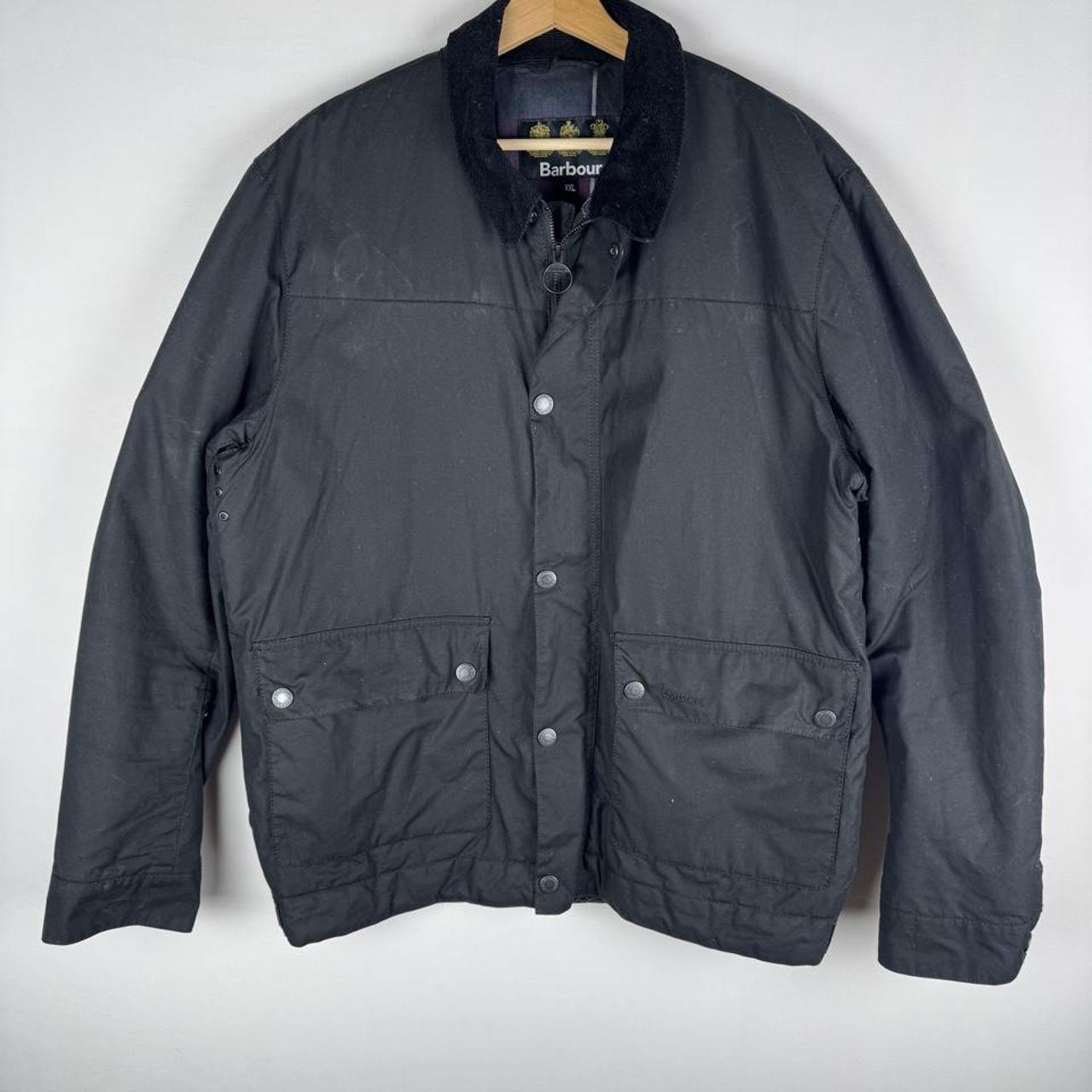 Barbour black wax jacket with logo detail and classic design, size XXL.
