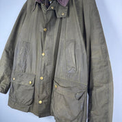 Barbour green wax jacket with logo, classic design, and durable material.