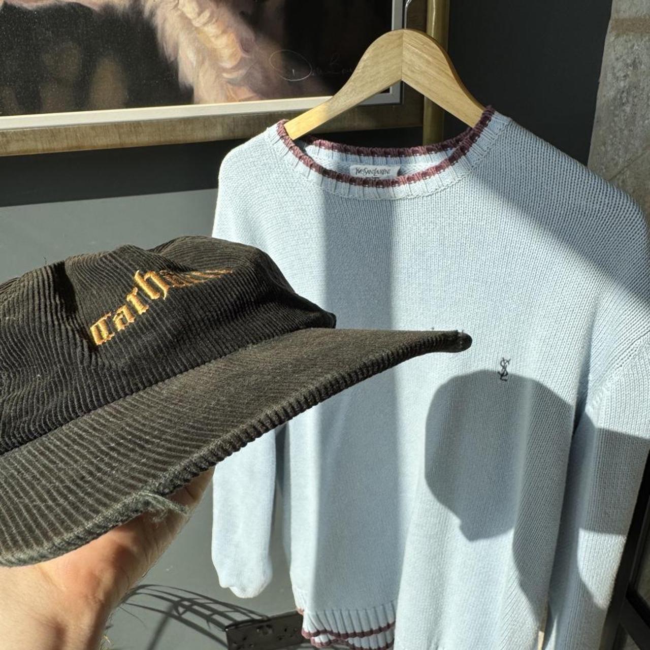 Carhartt WIP corduroy hat with embroidered logo and slight visor damage.