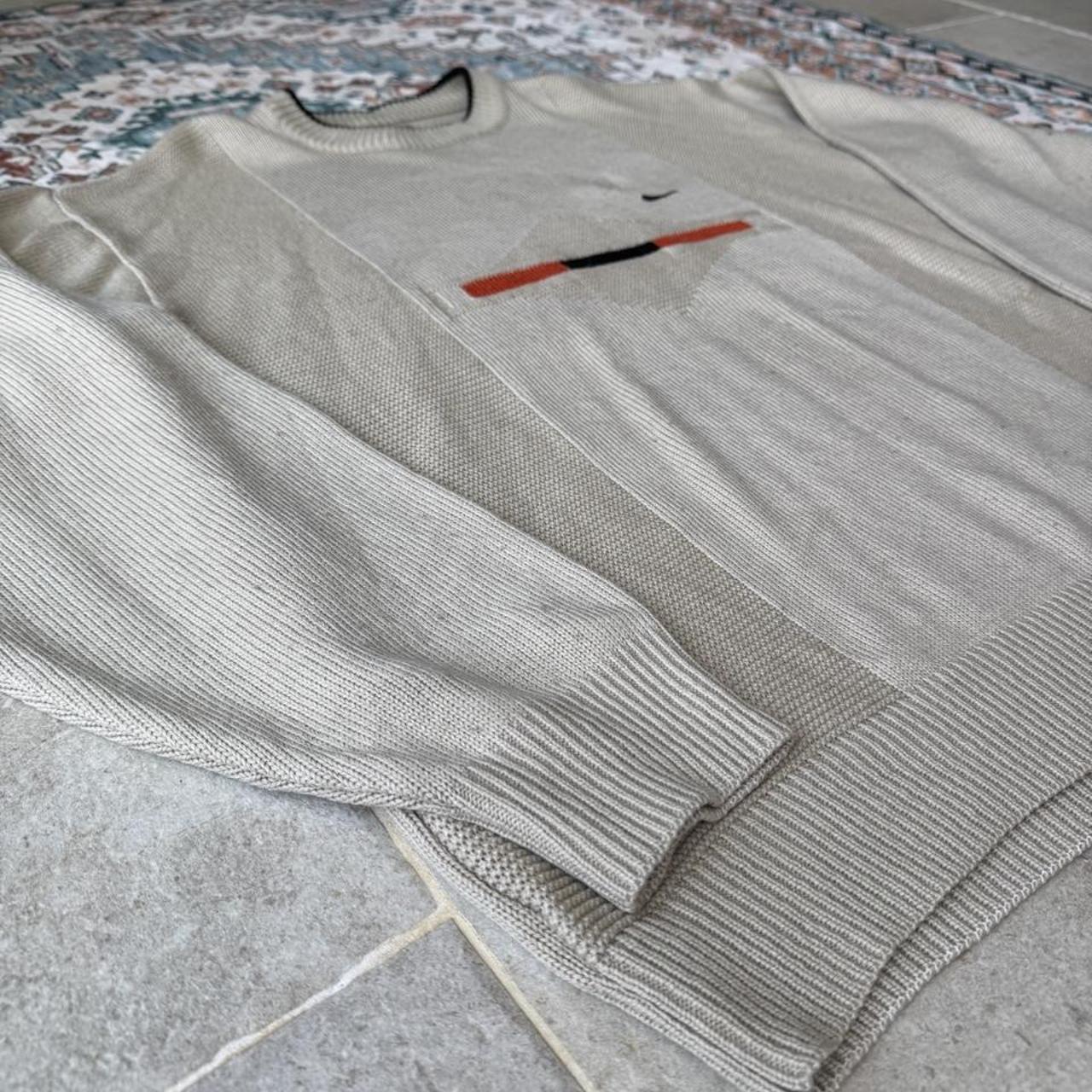 Nike cream knitted jumper with embroidered logo and visible marks from the 1990s.