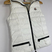Moncler white down puffer gilet with logo detail and missing belt.