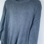 Yves Saint Laurent grey knitted jumper 1990s style with relaxed fit and ribbed texture.