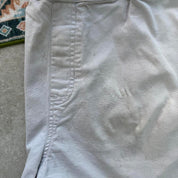 Quiksilver cream cargo shorts with embroidered logo and front pockets.