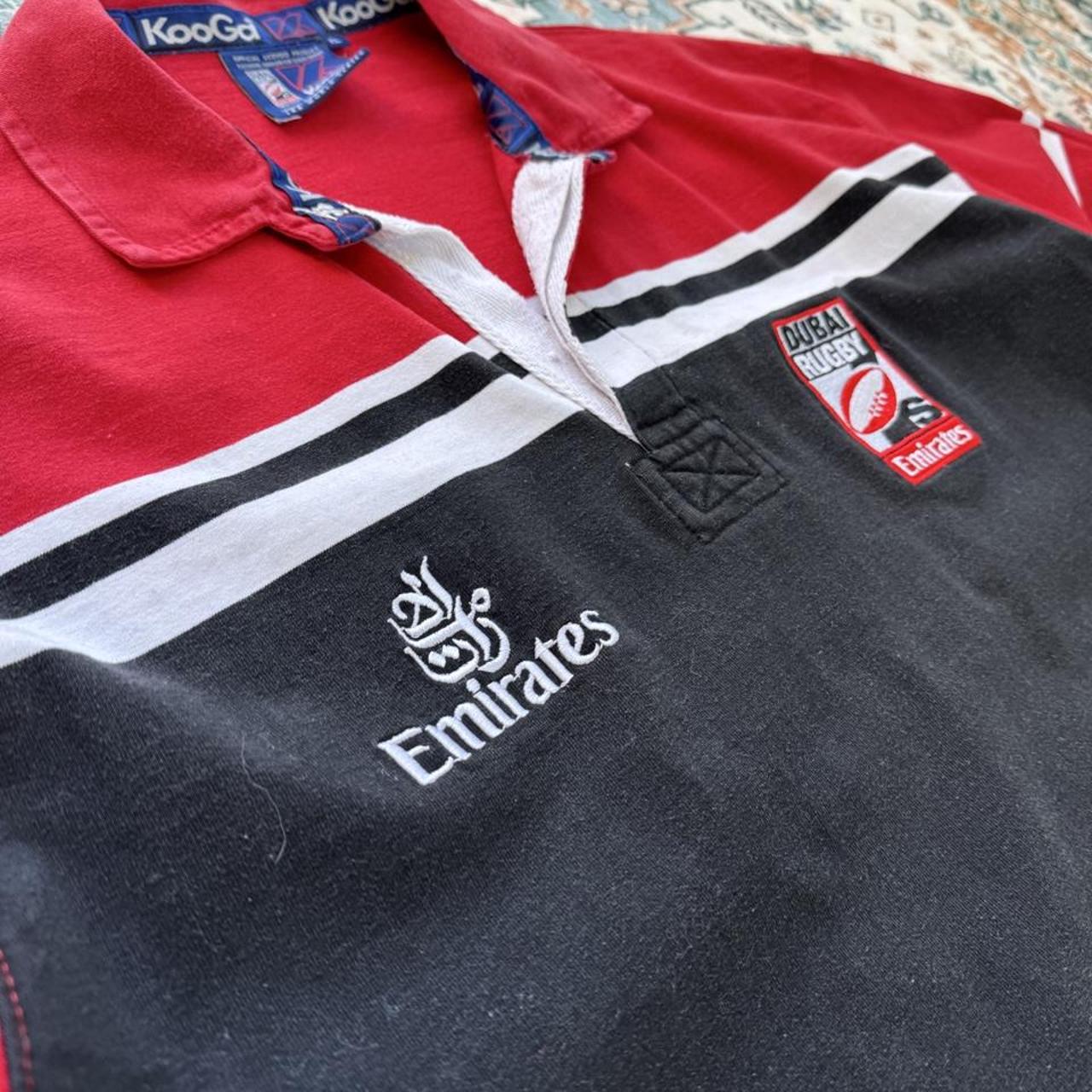Kooga men's rugby polo shirt, navy blue, embroidered Dubai 7s logo, cotton material.