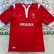 Reebok men's polo shirt red with Wales Rugby logo and slim fit design.