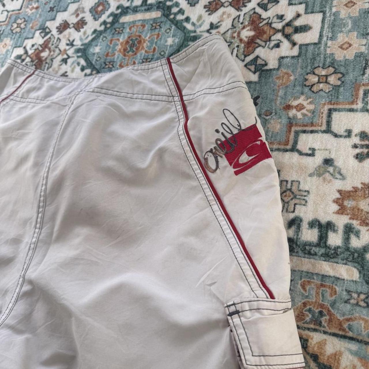O'Neill cream board shorts with embroidered logo and relaxed baggy fit.