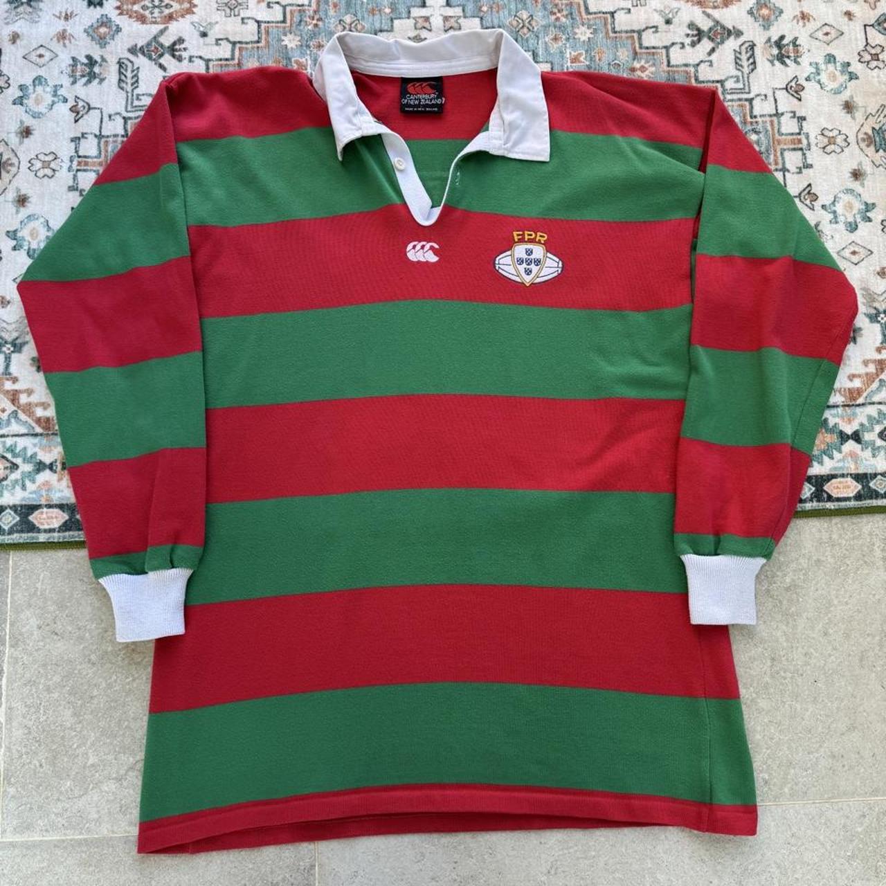 Canterbury men's rugby polo shirt red with embroidered Portugal logo and classic collar.