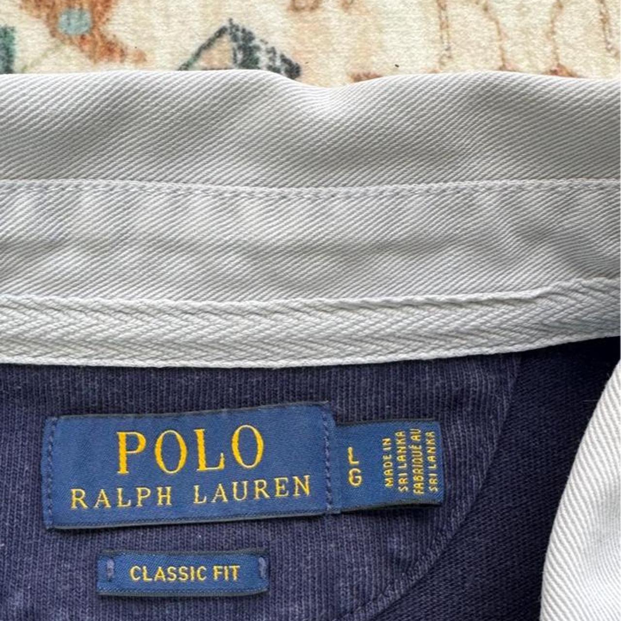 Polo Ralph Lauren navy rugby polo shirt with embroidered logo and thick fabric.