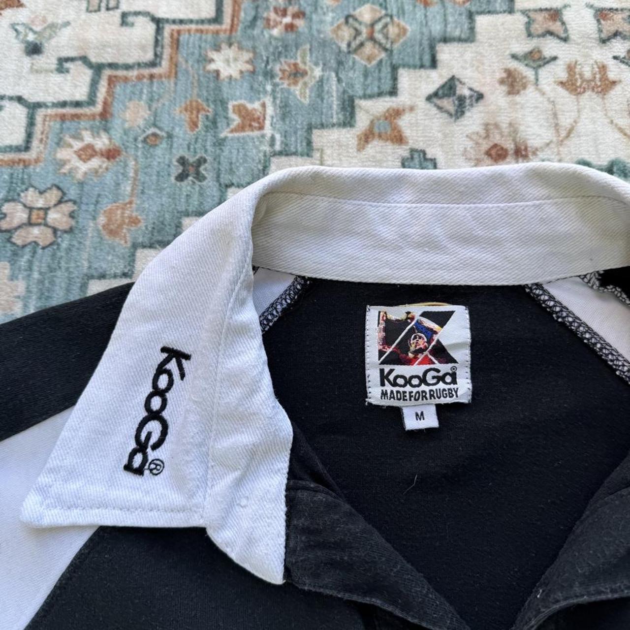 Kooga men's polo shirt, green with embroidered New Zealand logo and rugby collar.