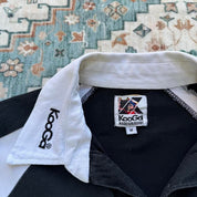 Kooga men's polo shirt, green with embroidered New Zealand logo and rugby collar.