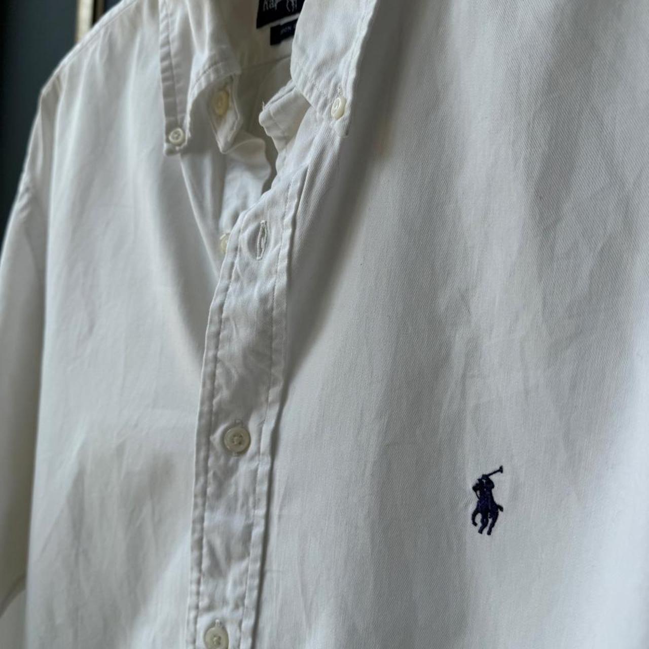 Polo Ralph Lauren white cotton shirt with embroidered logo and oversized fit.