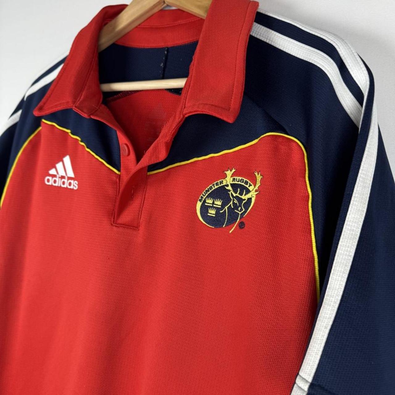 Adidas men's polo shirt in green with embroidered logo and classic collar.