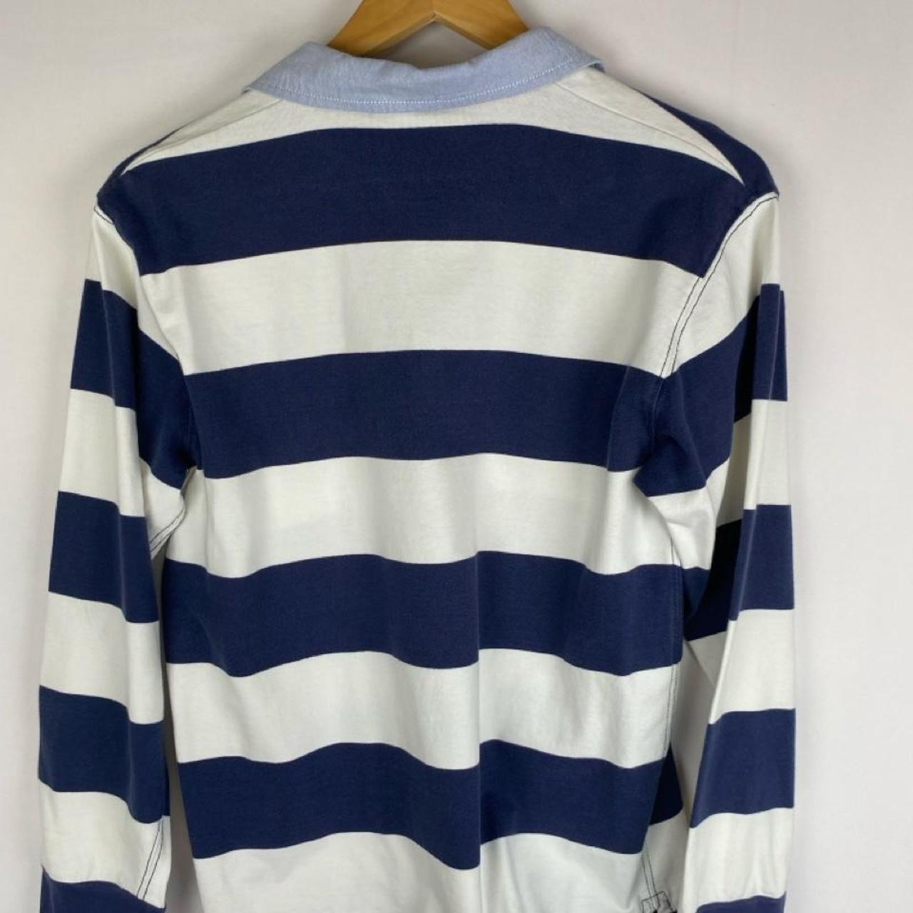 Polo Ralph Lauren blue and navy striped rugby polo shirt with logo detail.
