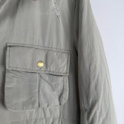 CP Company multi-colour utility parka jacket with multiple pockets and hood.