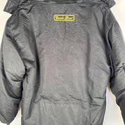 Canada Goose black and brown parka jacket with logo and utility pockets.