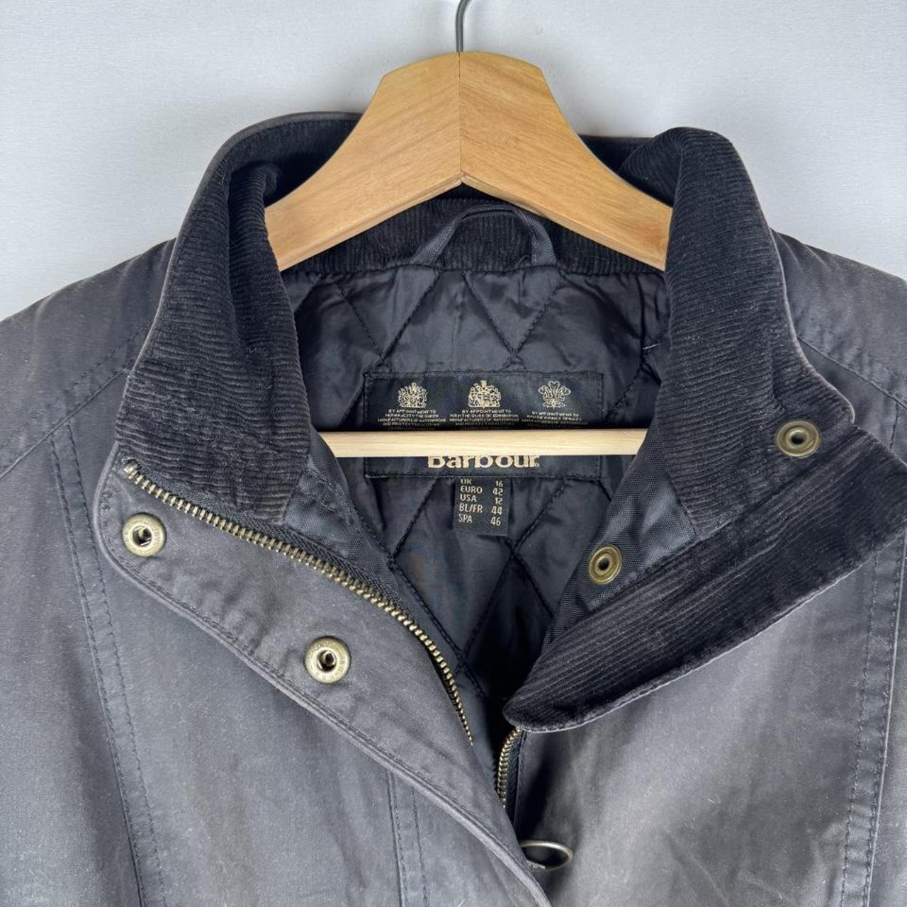Barbour black women's winter jacket with logo detail and slim fit design.