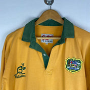 Cotton Traders green and yellow rugby polo with Wallabies logo and vintage design.