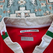 Reebok men's polo shirt red with Wales Rugby logo and slim fit design.