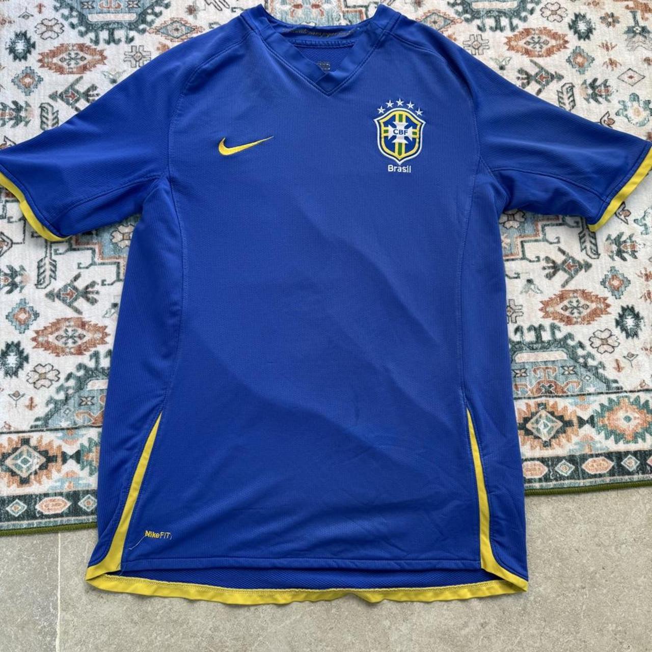 Nike blue Brazil away jersey with logo and classic design details.