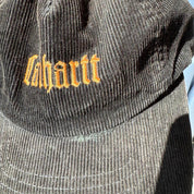 Carhartt WIP corduroy hat with embroidered logo and slight visor damage.